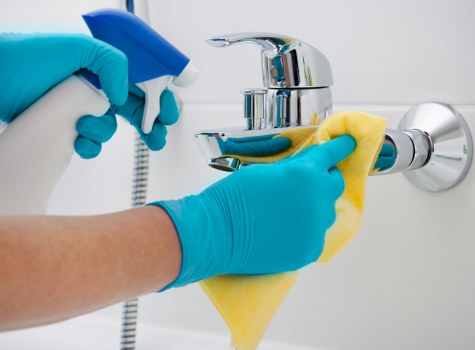 Spot cleaning a mattress stain with a mild cleaning solution