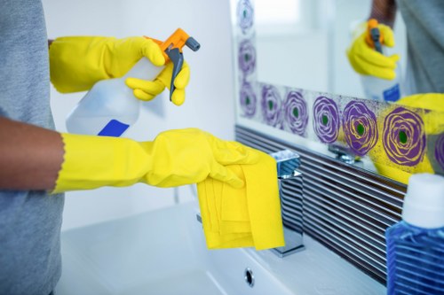 Wiping a kitchen oven during deep cleaning
